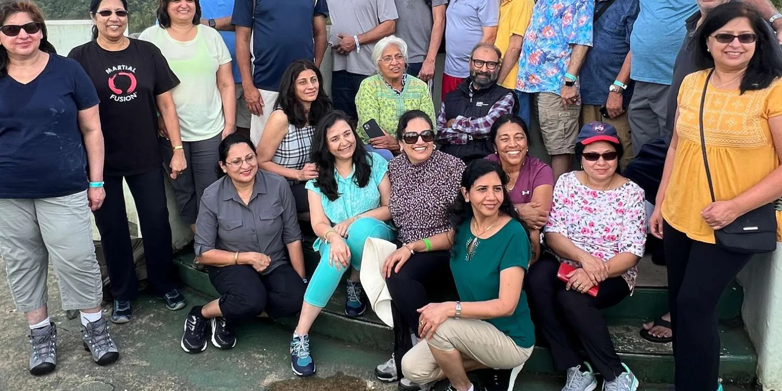 A tour group gathered for a photo at the forest viewpoint